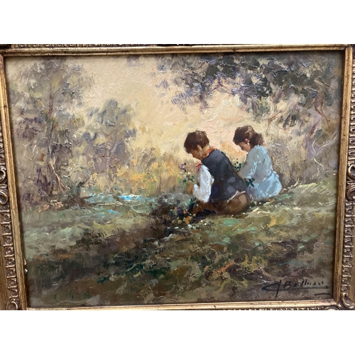 57 - A GILT FRAMED OIL ON BOARD OF TWO CHILDREN BY A RIVER SIGNED 29.5CM X 23CM