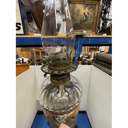 16 - AN ORNATE VICTORIAN OIL LAMP WITH GLASS FUNNEL