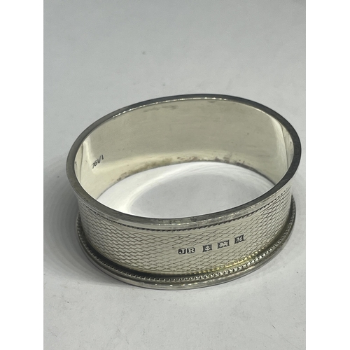 28 - FOUR NAPKIN RINGS TO INCLUDE THREE HALLMARKED BIRMINGHAM SILVER