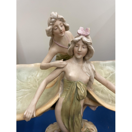 69 - A ROYAL DUX ART NOUVEAU CENTRE PIECE MODELLED AS SCANTILY CLAD WATER NYMPHS FLANKED BY LILY PADS CIR... 