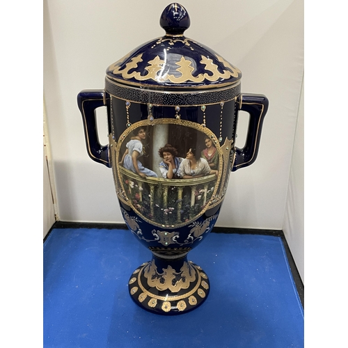 82 - A ROYAL LIMOGES TWIN HANDLED VASE IN BLUE AND GOLD WITH LADIES ON A BALCONY DECORATION HEIGHT 35CM