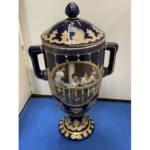 82 - A ROYAL LIMOGES TWIN HANDLED VASE IN BLUE AND GOLD WITH LADIES ON A BALCONY DECORATION HEIGHT 35CM