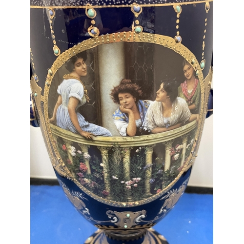 82 - A ROYAL LIMOGES TWIN HANDLED VASE IN BLUE AND GOLD WITH LADIES ON A BALCONY DECORATION HEIGHT 35CM