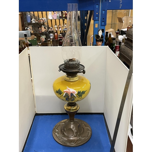 83 - AN ART NOUVEAU COPPER AND PAINTED GLASS OIL LAMP