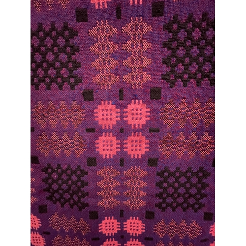 90 - A PURPLE LIQUORICE AND PINK PURE WOOL WELSH FRINGED TAPESTRY BLANKET 246CM X 200CM