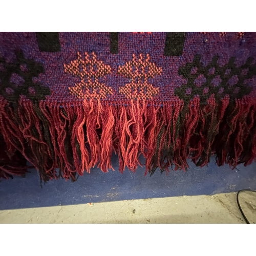 90 - A PURPLE LIQUORICE AND PINK PURE WOOL WELSH FRINGED TAPESTRY BLANKET 246CM X 200CM