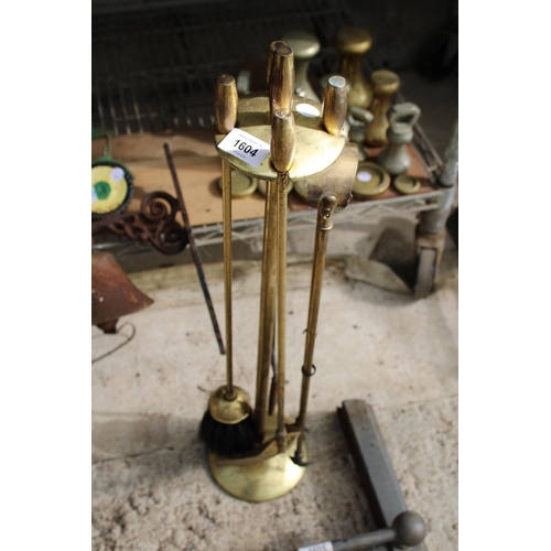 1604 - A VINTAGE BRASS COMPANION SET