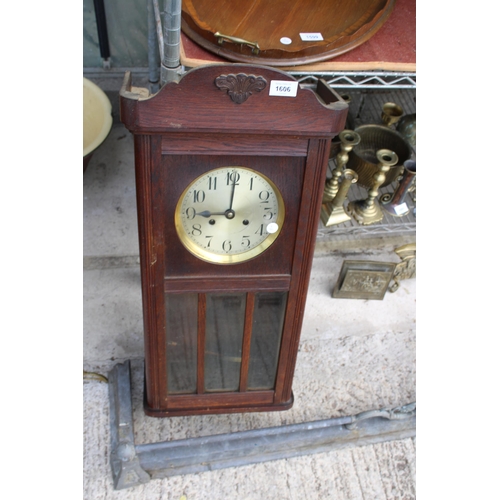 1606 - AN OAK CASED CHIMING WALL CLOCK