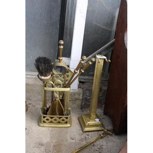 1646 - A VINTAGE BRASS COMPANION SET AND A FURTHER BRASS STAND