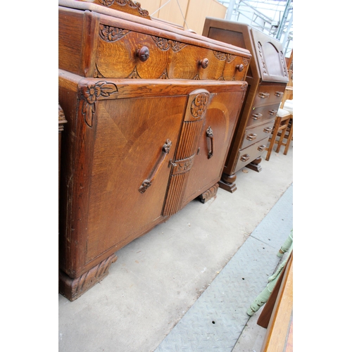 2619 - AN EARLY TWENTIETH CENTURY OAK SIDEBOARD ENCLOSING THREE DRAWERS AND TWO CUPBOARDS, 48