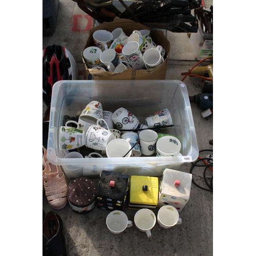 1892 - A LARGE ASSORTMENT OF CERAMIC CUPS AND BISCUIT BARRELS ETC