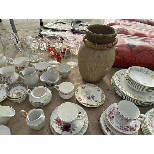 2046 - A LARGE ASSORTMENT OF CERAMICS AND GLASS WARE TO INCLUDE BOWLS, PLATES AND CUPS AND SAUCERS ETC