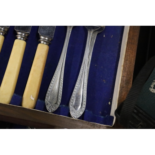 1005 - A VINTAGE CANTEEN OF CUTLERY IN A MAHOGANY CASE WITH BOTTOM DRAWER