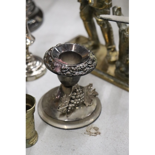 991 - A QUANTITY OF BRASS AND SILVER PLATE TO INCLUDE A HEAVY POACHER FIGURE, CANDLESTICKS, ANIMAL FIGURES... 