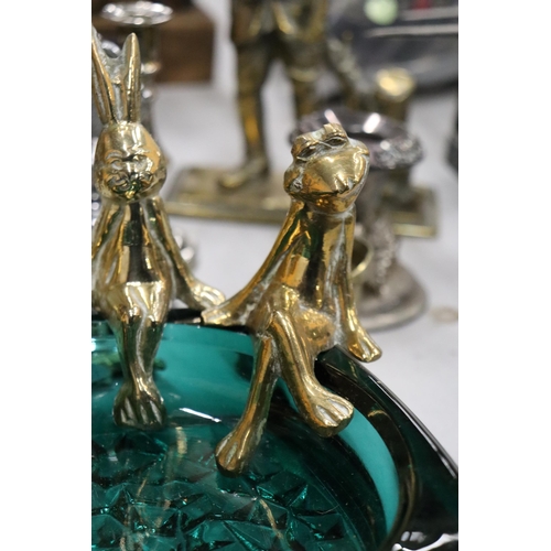 991 - A QUANTITY OF BRASS AND SILVER PLATE TO INCLUDE A HEAVY POACHER FIGURE, CANDLESTICKS, ANIMAL FIGURES... 