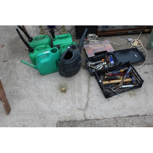 2211 - FOUR PLASTIC FUEL CANS, TWO WATERING CANS AND AN ASSORTMENT OF HAND TOOLS