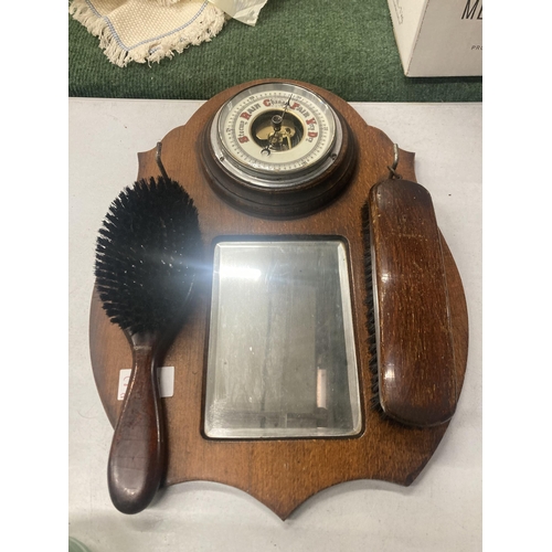 210A - A VINTAGE OAK HALL MIRROR WITH BAROMETER AND BRUSH