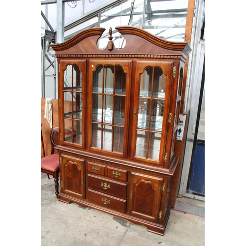 3130 - A MODERN HARDWOOD BOOKCASE ON BASE WITH SWAN NECK PEDIMENT, 56