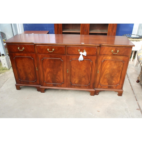 3136 - A MAHOGANY AND CROSS BANDED BREAKFRONT REPRODUX SIDEBOARD ENCLOSING FOUR DRAWERS AND FOUR CUPBOARDS,... 