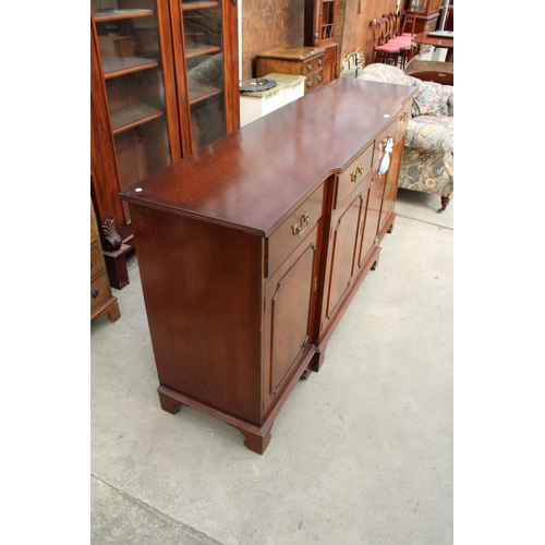 3136 - A MAHOGANY AND CROSS BANDED BREAKFRONT REPRODUX SIDEBOARD ENCLOSING FOUR DRAWERS AND FOUR CUPBOARDS,... 