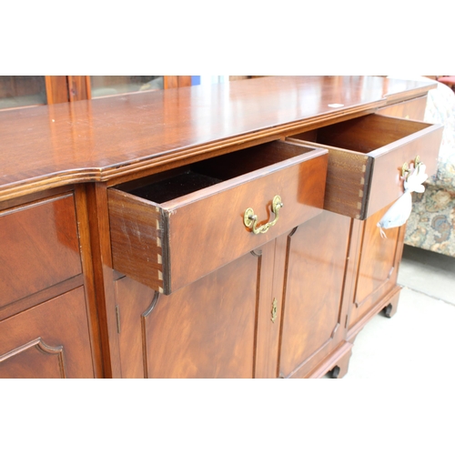 3136 - A MAHOGANY AND CROSS BANDED BREAKFRONT REPRODUX SIDEBOARD ENCLOSING FOUR DRAWERS AND FOUR CUPBOARDS,... 