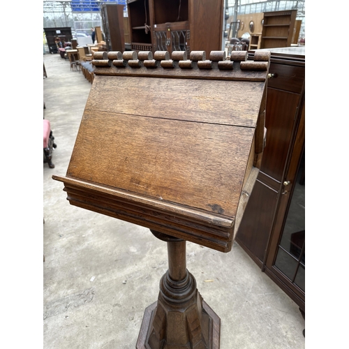 2510A - AN DOUBLE SIDED OAK CHOIR LECTERN WITH TURNED AND CARVED COLUMN