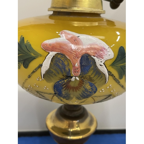 83 - AN ART NOUVEAU COPPER AND PAINTED GLASS OIL LAMP