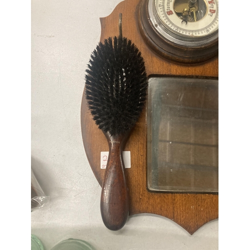 210A - A VINTAGE OAK HALL MIRROR WITH BAROMETER AND BRUSH