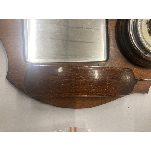 210A - A VINTAGE OAK HALL MIRROR WITH BAROMETER AND BRUSH