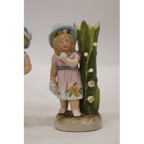 229 - TWO VINTAGE GERMAN CONTA AND BOHME FAIRINGS TO INCLUDE A GIRL WITH JUG VASE AND A GIRL WITH BASKET V... 