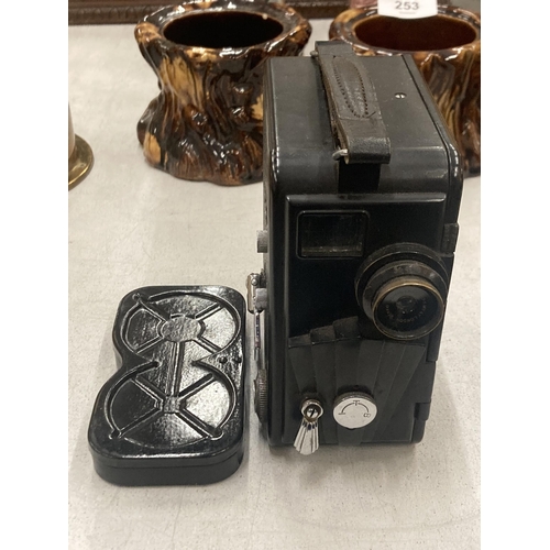 254 - A VINTAGE BAKELITE DEKKO CINE CAMERA AND FILM