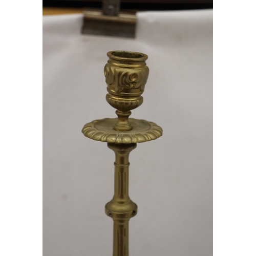 299A - A VINTAGE STYLE HEAVY BRASS CANDLE HOLDER, HEIGHT 55CM