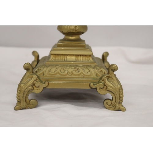 299A - A VINTAGE STYLE HEAVY BRASS CANDLE HOLDER, HEIGHT 55CM