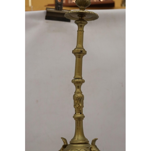 299A - A VINTAGE STYLE HEAVY BRASS CANDLE HOLDER, HEIGHT 55CM