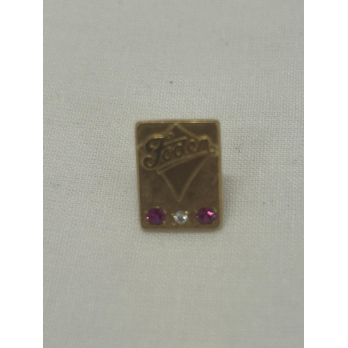 545 - A HALLMARKED 9CT GOLD DIAMOND AND RUBY 'FODEN' PIN BADGE GROSS WEIGHT 4.84G