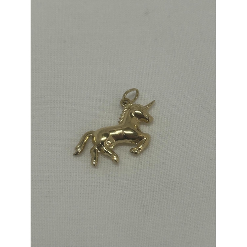 549 - A 9CT YELLOW GOLD UNICORN CHARM