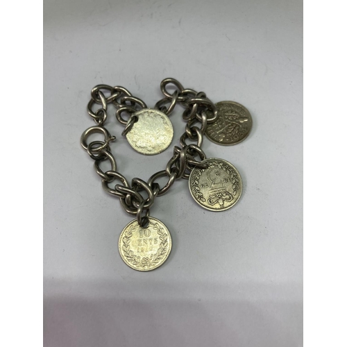 552 - A SILVER COIN CHARM BRACELET