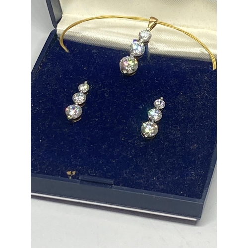 564 - A SILVER CUBIC ZIRCONIA PENDANT AND EARRING SET IN A PRESENTATION BOX