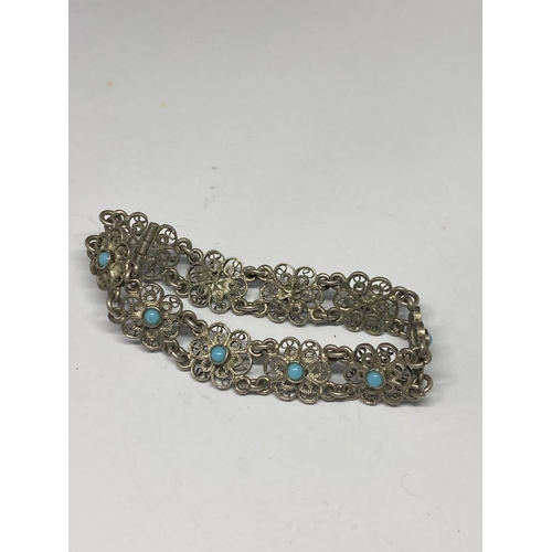 567 - TWO SILVER AND STONE BRACELETS