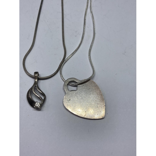 579 - FOUR SILVER NECKLACES WITH PENDANTS