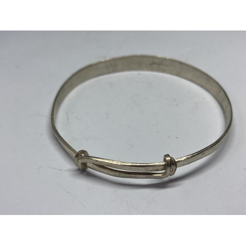 581 - TWO SILVER BANGLES