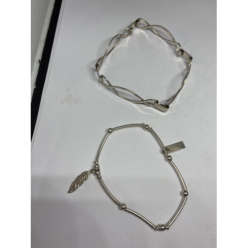 597 - FOUR SILVER BRACELETS