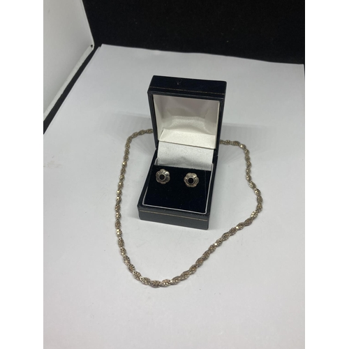 599 - A PAIR OF SILVER EARRINGS AND A SILVER NECKLACE IN A PRESENTATION BOX