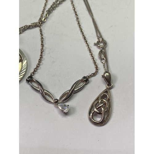 635 - FOUR SILVER NECKLACES WITH PENDANTS