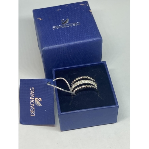 705 - A SWAROVSKI CRYSTAL RING SIZE Q/R WITH LABEL AND PRESENTATION BOX