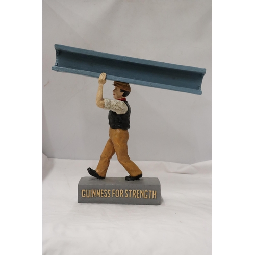 858 - A RESIN FIGURE, 'GUINNESS FOR STRENGTH', HEIGHT 36CM, WIDTH 34CM