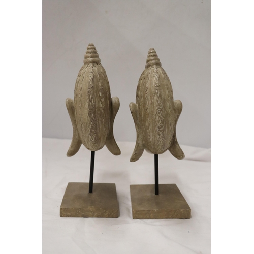 861 - TWO BUDDAH HEADS ON STANDS, HEIGHT 27CM