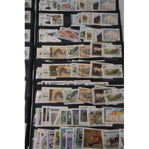 864 - A COLLECTION OF STAMPS ON STOCK CARDS