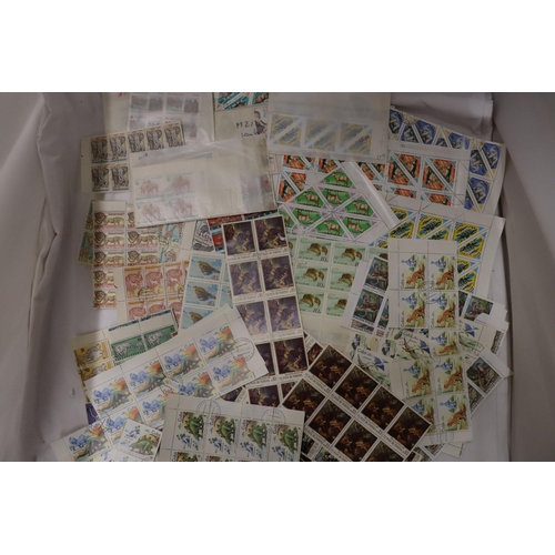 875 - A COLLECTION OF BLOCKS OF STAMPS