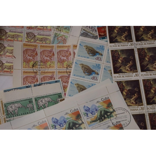 875 - A COLLECTION OF BLOCKS OF STAMPS